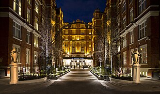 The tree-lined courtyard and entrance to St Ermin's Hotel at night